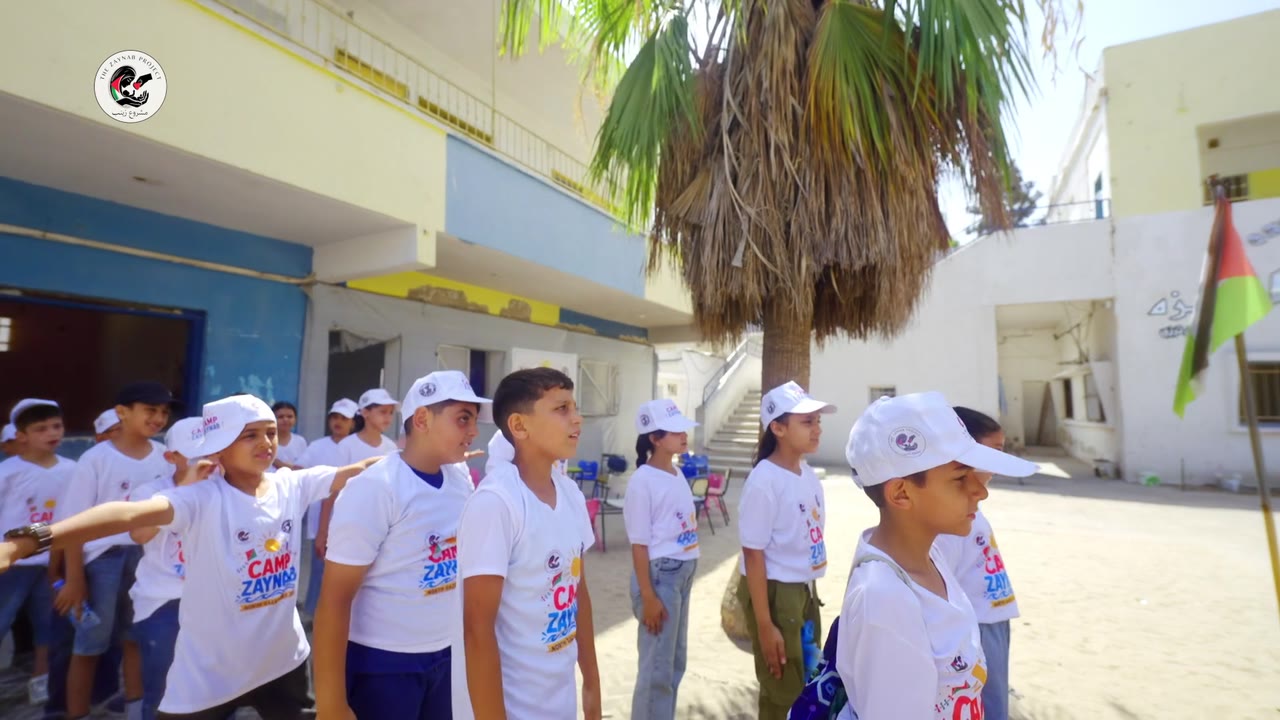 Children gathered for a group activity in the Camp Zaynab courtyard